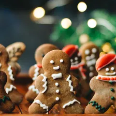 It's beginning to look a lot like Christmas. These cute gingerbread men cookies are arranged to look like a happy little army, with festive lights creating a warm bokeh background.