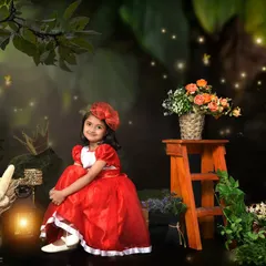 An enchanting forest portrait for a fifth birthday. The magical lighting and rich colors create a storybook scene for this beautiful girl.