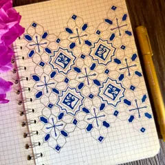 I love how the simple addition of color can transform a pattern. This design uses a cool blue and silver-grey palette to create a calming, almost tile-like effect on the page.