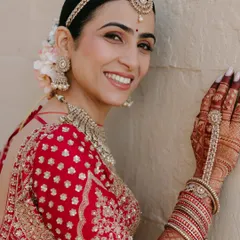 The pure joy of a bride on her wedding day is my biggest reward. For Varsha's Anand Karaj ceremony, we created a luminous, soft-focus look with clean lines and a radiant finish that honored the sanctity of the occasion while letting her happiness shine through.