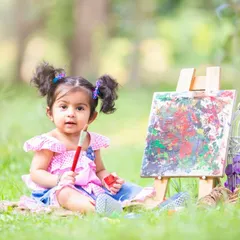 I believe in capturing creativity in action. For this "little artist" session, I set up a canvas and paints to document the pure joy of creation.