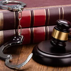 Handcuffs and law books symbolize the intersection of freedom and justice. My work as a criminal lawyer is to navigate this complex area and secure the best possible outcome for you.