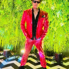 This was the closest I could get to a Santa look for a Christmas-themed sangeet in Vadodara. Rocking a red hot suit to bring the festive cheer.