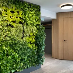 We integrated this vertical garden into a corporate hallway, turning a functional area into a memorable design feature. The wall of greenery provides a refreshing visual break and improves the indoor environmental quality.