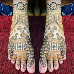 A mirrored peacock design for the feet, where the feathers create a beautiful fan-like pattern. This is a very popular choice for brides.
