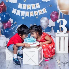 Capturing the bond between siblings during a milestone shoot is always special. These two couldn't wait to dig into the cake together for this third birthday celebration, and their shared excitement was wonderful to photograph.