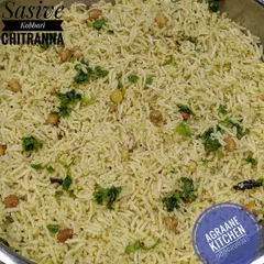 Sasive Kobbari Chitranna is a traditional lemon rice variant made with a paste of mustard seeds and coconut. This gives the dish a unique, pungent, and refreshing flavor.