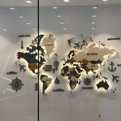 The backlit world map seen through a glass partition, demonstrating how it acts as a striking feature visible from multiple areas of the office.