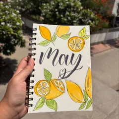 A journal entry I created to welcome the month of May, featuring lemon illustrations and calligraphy. My journal is where many of my ideas begin.