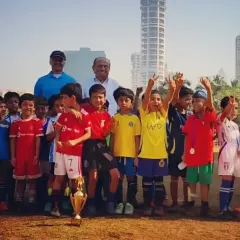 A moment of pure celebration with the team and their trophy. These are the moments that build lifelong memories and reinforce the value of hard work and teamwork.