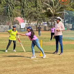 A woman bowls with focus during a Parents Premier League match. We create a supportive space for women to participate and compete in our tennis ball cricket tournaments.