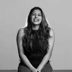 A candid and joyful monochrome portrait. The genuine laughter and simple lighting create an image that is both beautiful and relatable.