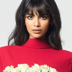 A close-up from an editorial feature where the brief was 'bold yet graceful'. I focused on a sharp, smoked-out eye and a soft nude lip to complement the model's strong features and the vibrant red styling, creating a powerful and memorable image.
