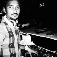 A black and white photo from an earlier gig. This captures a moment of focus at the console, building my experience one party at a time.