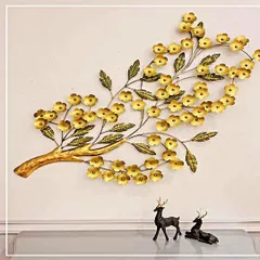 A beautiful representation of nature, this wall art features a branch laden with delicate golden flowers. Handcrafted from wrought iron, this piece brings a touch of organic elegance and antique charm to your living space.