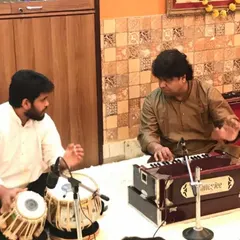 I am here today because of the blessings and teachings of my Guruji, Pandit Subhankar Banerjee ji. This photo captures a moment of learning from him, a memory I cherish. Every lesson I teach is a tribute to his guidance.