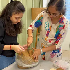 The process begins here. Our instructors prepare the natural clay, ensuring everyone gets the perfect portion to start their creative journey.