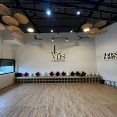 Welcome to our creative home. We've designed our studio to be a world-class space with sprung wooden floors to protect your joints, professional sound systems, and an inspiring atmosphere. This is where you'll grow, learn, and find your rhythm.