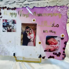 Handmade with love for a beautiful couple on their first anniversary. This plaque includes their wedding photo, a picture of their new baby, and the date, all set in a lovely purple and white resin design.