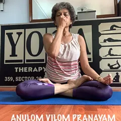 I am demonstrating Anulom Vilom Pranayam, a key breathing technique we practice. This alternate nostril breathing is excellent for calming an anxious mind, balancing your energy, and improving sleep during pregnancy.