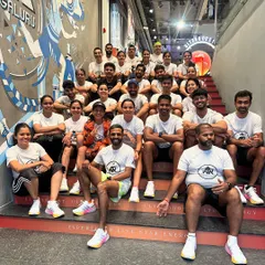 The crew taking over the stairs at the Adidas store for a group photo. Our community events are always full of energy and fun.