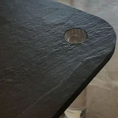 A close-up on the slate stone tabletop. I love playing with textures, and the natural, rugged surface of the stone is a fantastic alternative to traditional marble, adding depth and character.