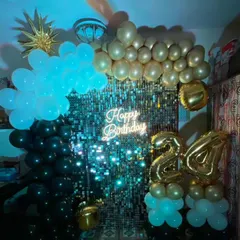 The same shimmer wall setup seen with blue uplighting, which completely changes the mood and makes the sequins sparkle differently. We can customize the lighting to fit your party's theme.