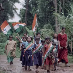 School children from a rural village marching with Indian flags on Independence Day. I believe authentic documentary photography lies in capturing such simple, heartfelt moments of community pride.