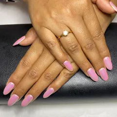 This full set of almond-shaped gel extensions is finished with a pink unicorn chrome. The effect creates a beautiful, iridescent sheen that shifts colors in the light.