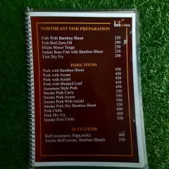 Our menu page for Northeast fish, pork, and buff preparations. You can see options like Fish with Bamboo Shoot, Smoked Pork with Axone, and Naga-style Buff.