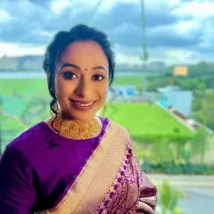 A happy, natural shot of my client. The soft glam makeup and braided bun create a look that is both traditional and effortlessly beautiful.