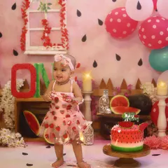 Getting delightfully messy with her watermelon cake! These are the moments I love to capture during a first birthday cake smash photoshoot.