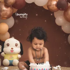 Let's get messy! A first birthday cake smash is all about capturing pure, unfiltered joy. This little one is having the time of his life with his first taste of cake in our cozy, earth toned studio setup.