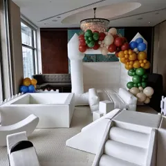 A closer look at our versatile white bouncy castle and soft play rental. The neutral color scheme allows it to fit seamlessly into any party theme, from birthdays to family gatherings, while providing endless entertainment.