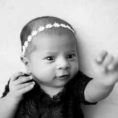 "Hang loose!" This black and white shot captures a baby girl with so much personality in her expression and hand gesture.