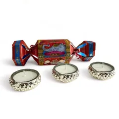 The 'Aatash' Diwali gift set includes three antique-finished silver glass diyas and a box of delicious toffees from the iconic Parsi Dairy Farm.