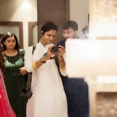 Here I am behind the camera, sharing a just-captured moment with the groom. I believe in a collaborative and friendly approach, ensuring you are part of the creative process and comfortable throughout the day.