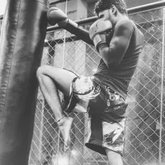 A powerful knee strike on the heavy bag. This kind of kickboxing drill is essential for developing power in your strikes. We spend a lot of time on bag work to build stamina and perfect our technique.