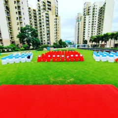 A large-scale outdoor setup on a community lawn for Independence Day. We arranged hundreds of chairs in a patriotic color scheme, demonstrating our capability to manage events for large crowds.