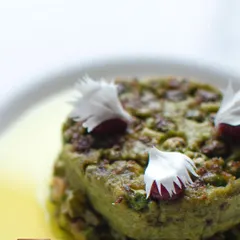 A close-up of the delicate textures and edible flower garnish on our galouti. I believe that food should be a feast for the eyes as well as the palate.