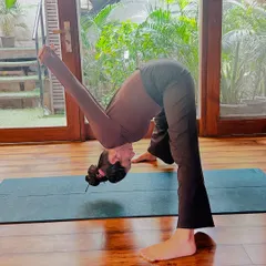 A deep forward fold, Parsvottanasana, is excellent for stretching the hamstrings and spine. A perfect way to start your morning yoga routine.