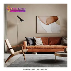 A modern living room setting featuring our custom rust-colored sofa. The clean lines and plush fabric provide a warm and inviting focal point, paired here with a woven wood accent chair to create a balanced, contemporary space.