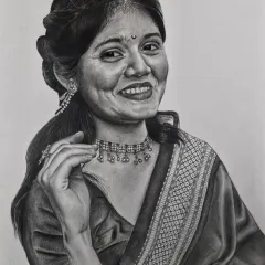 A beautiful example of a commissioned solo portrait. I use graphite and pencil to create soft tones and intricate details, from the pattern on the saree to the delicate jewelry, resulting in a timeless and personal piece of art.