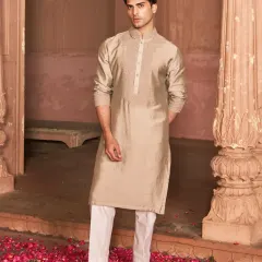 For the groomsman who favors finesse over flash, this neutral-toned kurta set is an ideal choice. The clean lines and subtle tone-on-tone embroidery create a look that is polished, refined, and effortlessly stylish.