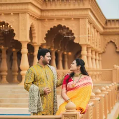 Dressed in elegant ethnic wear, this couple's pre-wedding shoot at a heritage location combines tradition with grandeur. The intricate architecture provides a timeless backdrop for their portraits.