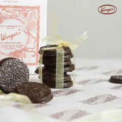 A stack of our chocolate-dipped biscuits, tied with a ribbon. These simple, elegant cookies are perfect with a cup of tea or coffee.