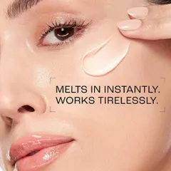 A macro beauty shot for a Lakmé skincare advertisement, demonstrating the product's texture. The image shows a creamy formula being applied to the model's cheek, with text overlay explaining how it "melts in instantly," focusing on the sensory experience of the product.
