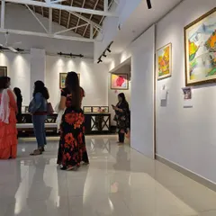 Visitors enjoy the "Timeless Whispers" exhibition, featuring artworks by Syeda Arifa Tasneem. Our gallery is a space for the community to come together and experience art.