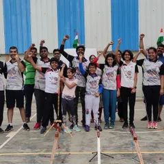 The spirit of our team is our greatest strength. Here we are, arms raised in celebration, fostering a sense of unity and shared purpose that extends beyond the archery range.