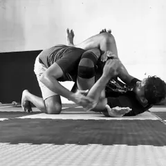 This is the intensity of No-Gi grappling. In this black and white shot, you can see the focus required during a live roll, working to pass the guard. It's a physical and mental chess match every time.